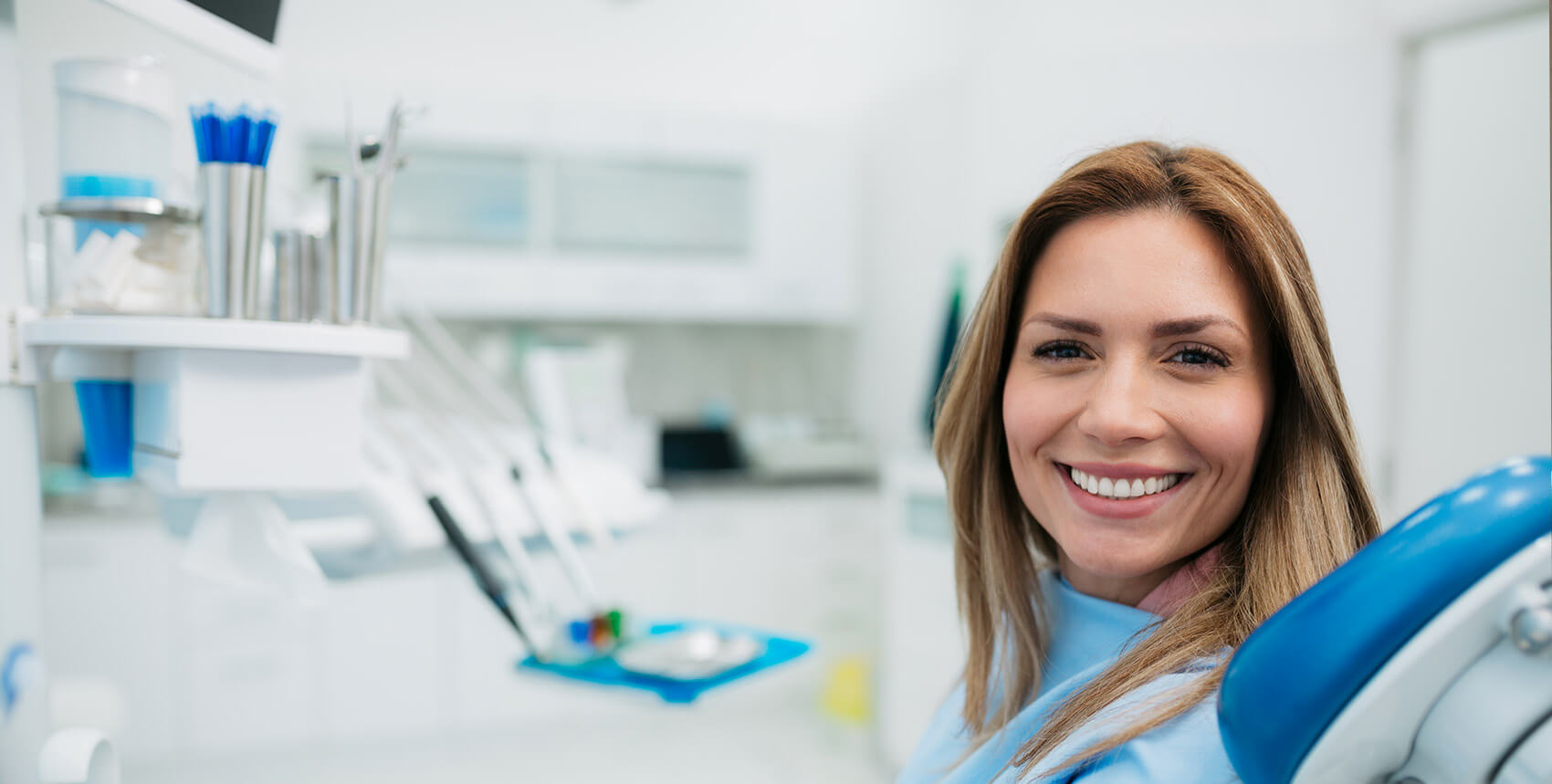 smiling woman sitting in a dental chair